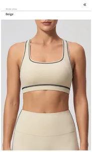 Detail of creamy apricot yoga set with black contrast stitching and square neckline
