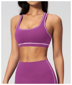 Detail of purple yoga set showing white contrast stitching on high-stretch fabric