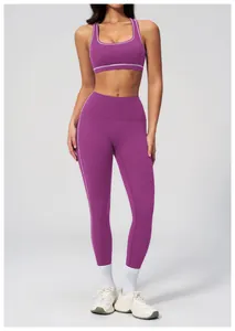 Detail of burgundy yoga set featuring contrast white stitching and high waist fit