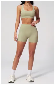 Detail of light olive green yoga set featuring high-elasticity fabric and matte texture