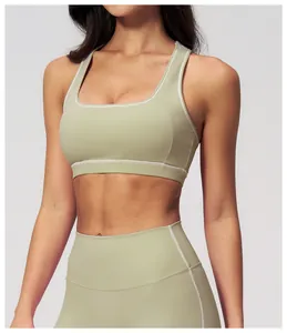 Detailed view of sage green yoga set with high-stretch fabric and contrast stitching