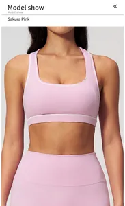 Front view of cherry blossom pink yoga set featuring racerback bra with white trim