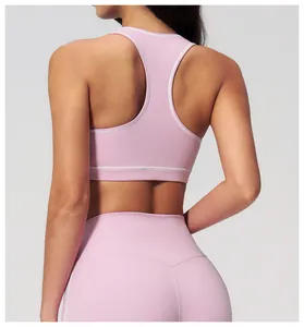 Detail of pink racerback yoga top showing the stitching and high-quality fabric