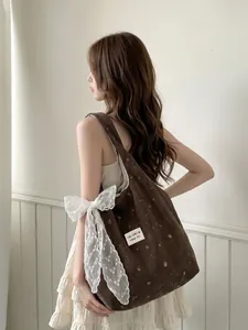 Sac fourre-tout en velours côtelé marron avec broderie et nœud en dentelle