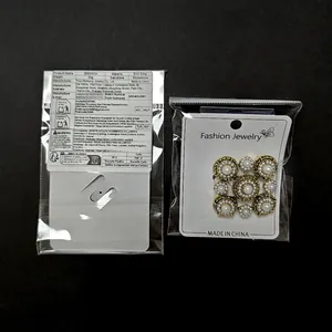 Detailed back label and front view of vintage Baroque pearl brooch in zinc alloy