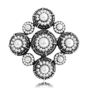 Vintage Baroque pearl brooch with starburst design and antique silver finish