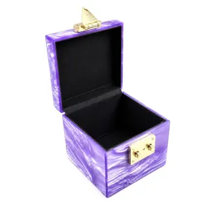 Elegant purple marble acrylic box handbag with a gold metal clasp and black interior