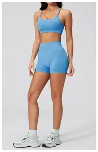 Sky blue seamless two-piece yoga set with high waist shorts and sports bra detail