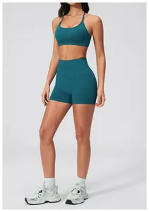 Detail of high waist teal seamless yoga set showing flexible fabric texture