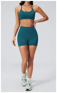 Peacock blue seamless ribbed yoga set featuring racerback sports bra and high waist shorts