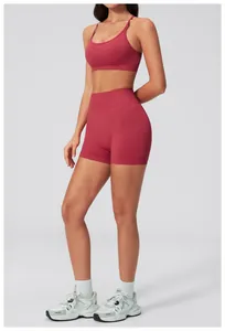 Close-up of seamless dark rose yoga set featuring ribbed high-waist shorts and sports bra