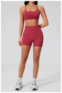 Detail view of burgundy two-piece seamless yoga set with U-neck bra and high waist shorts