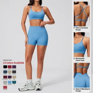 Women's light blue ribbed yoga set with strappy sports bra and high-waisted shorts