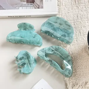 Set of 4 blue marble pattern acrylic hair claws including large and small styles