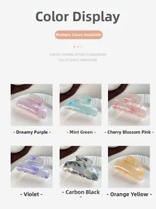 Detail showing various candy colored acrylic hair claw clips in marble texture finishes