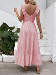 Detailed back view of pink backless tiered summer dress with ruffle sleeves