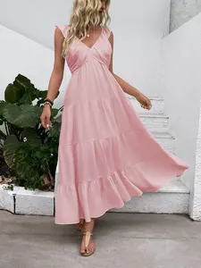 Close-up of pink sleeveless V-neck maxi dress with tiered skirt and soft ruffle details