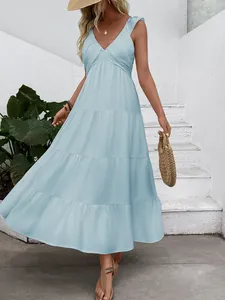 Detailed close-up of light blue sleeveless tiered maxi dress with V-neck and pleats
