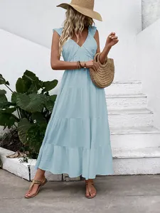 Detail of light blue sleeveless V-neck tiered maxi dress in summer vacation style