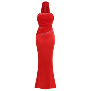 Detail of red bodycon dress featuring rhinestone embellishments and satin ruched fabric