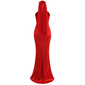Detail of red backless halter evening dress featuring a long elegant silk scarf design