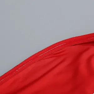 Detail of red fabric dress with non-slip silicone strip for secure fit and comfort