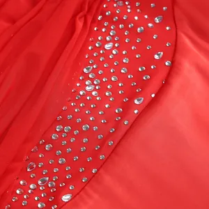 Detail of red mesh and satin dress with silver rhinestones and teardrop crystals