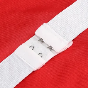 Detail of adjustable metal hooks and white elastic straps on a red evening dress