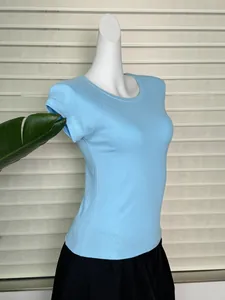 Detail view of slim-fit light blue crew neck T-shirt with raglan sleeves on mannequin