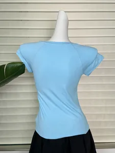Close-up of light blue ribbed knit t-shirt back with raglan sleeves and slim fit design