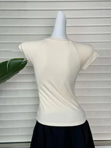Slim fit raglan sleeve crop top in cream white on mannequin with black skirt