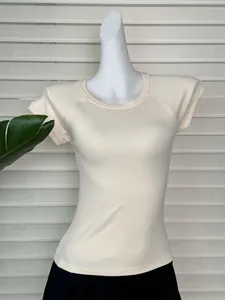 Detail of cream rib-knit texture on a crewneck short sleeve slim fit raglan t-shirt