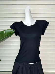 Detail of a slim-fit black raglan short sleeve t-shirt with ribbed texture and crew neck