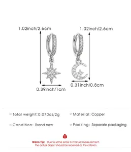 Detail view of silver copper star and moon hoop earrings with pavé cubic zirconia