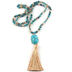 Bohemian long beaded necklace with turquoise stones, gold accents and silk tassel