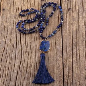 Bohemian long necklace with blue natural stone pendant, gold trim and silk tassel