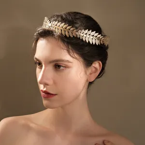Detailed texture of golden laurel leaf headband with intricate metallic leaf veins