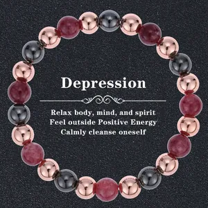 Macro detail of natural stone beaded bracelet with rose gold and metallic beads