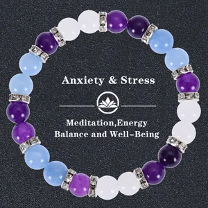 Detail of beaded yoga bracelet with lotus charm for anxiety relief and energy balance