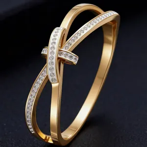 Detailed macro view of gold titanium steel bow knot bangle with sparkling crystal pave detail