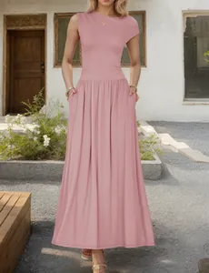Detail view of pink sleeveless maxi dress featuring a pleated shoulder and side pockets