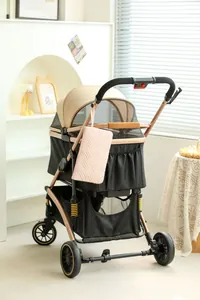 Pink quilted travel organizer bag hanging on a modern pet stroller handle detail