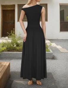 Detail of elegant black one-shoulder maxi dress with a flowing A-line wide skirt