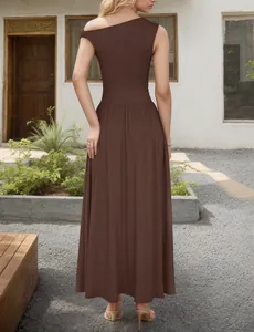 Elegant deep brown one-shoulder maxi dress featuring flowy skirt and waist tailoring