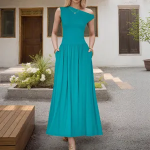 Elegant teal off-shoulder maxi dress with side pockets and a wide flowing hemline