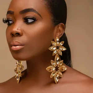 Exaggerated floral rhinestone drop earrings in gold finish for luxury evening wear