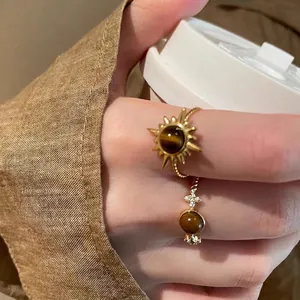 Golden sunburst tiger eye ring set for women with vintage aesthetic and luxury design