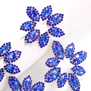 Luxurious deep blue crystal flower drop earrings with silver claw setting for formal events