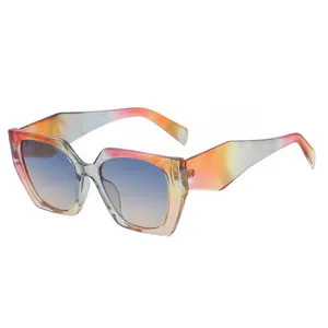 Fashionable oversized cat eye sunglasses with colorful gradient frame and blue lenses