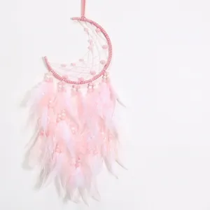 Pink moon dream catcher with delicate white feathers and beads for home wall decoration